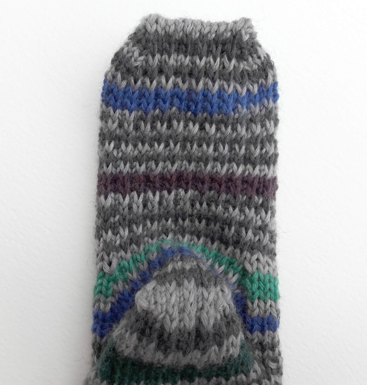 Reinforced heel and sole on hand knitted sock