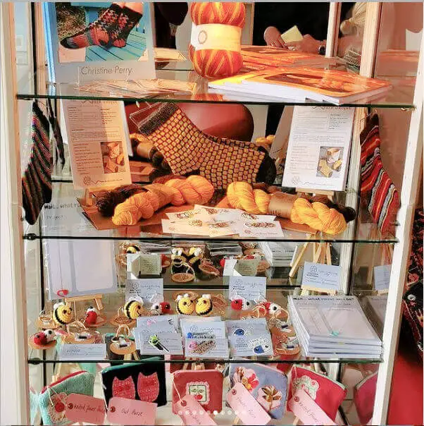 The rest of the showcase shelves filled with local crafts.