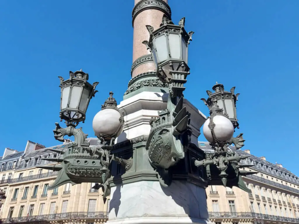 Three decorative metal galleon ship holds a light fitting on a street light