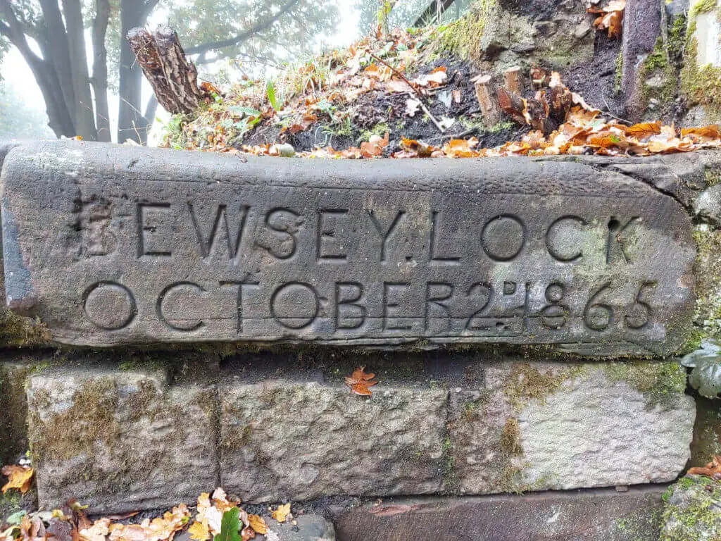 A large grey stone with the words "Bewsey Lock, October 2nd, 1865" inscribed on it