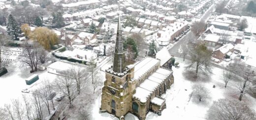 An aerial view of St Oswald's Church and Winwick village in the snow, credit www.snapshotstudios.co.uk