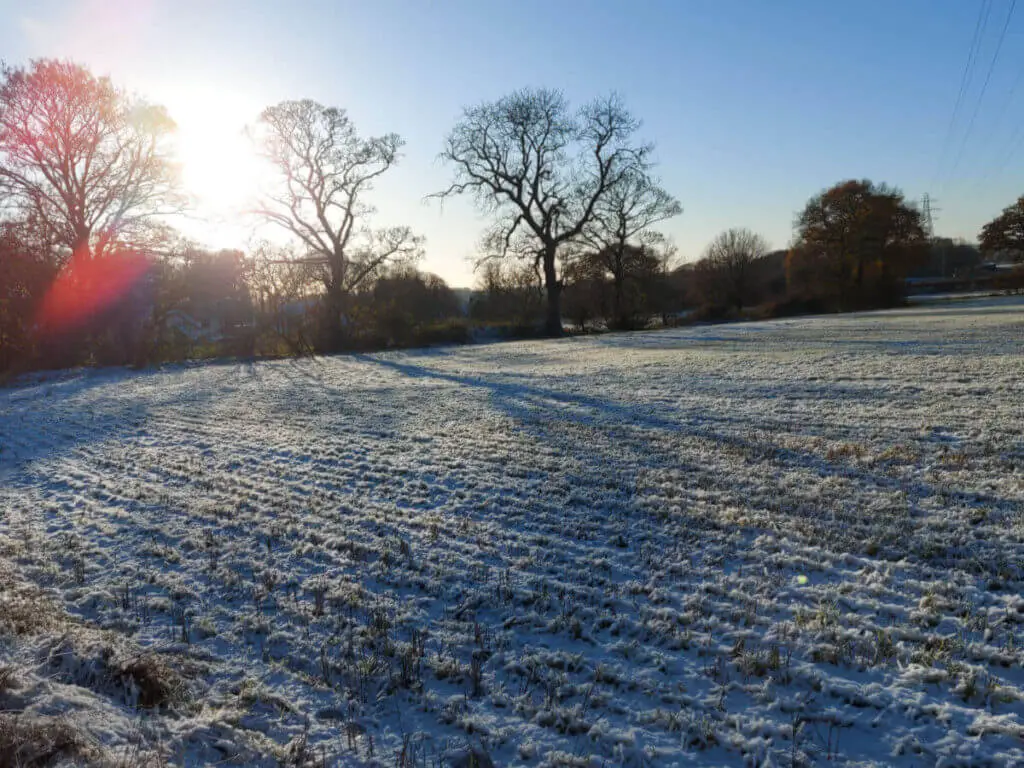 Snow lying in the ridges of a ploughed field
