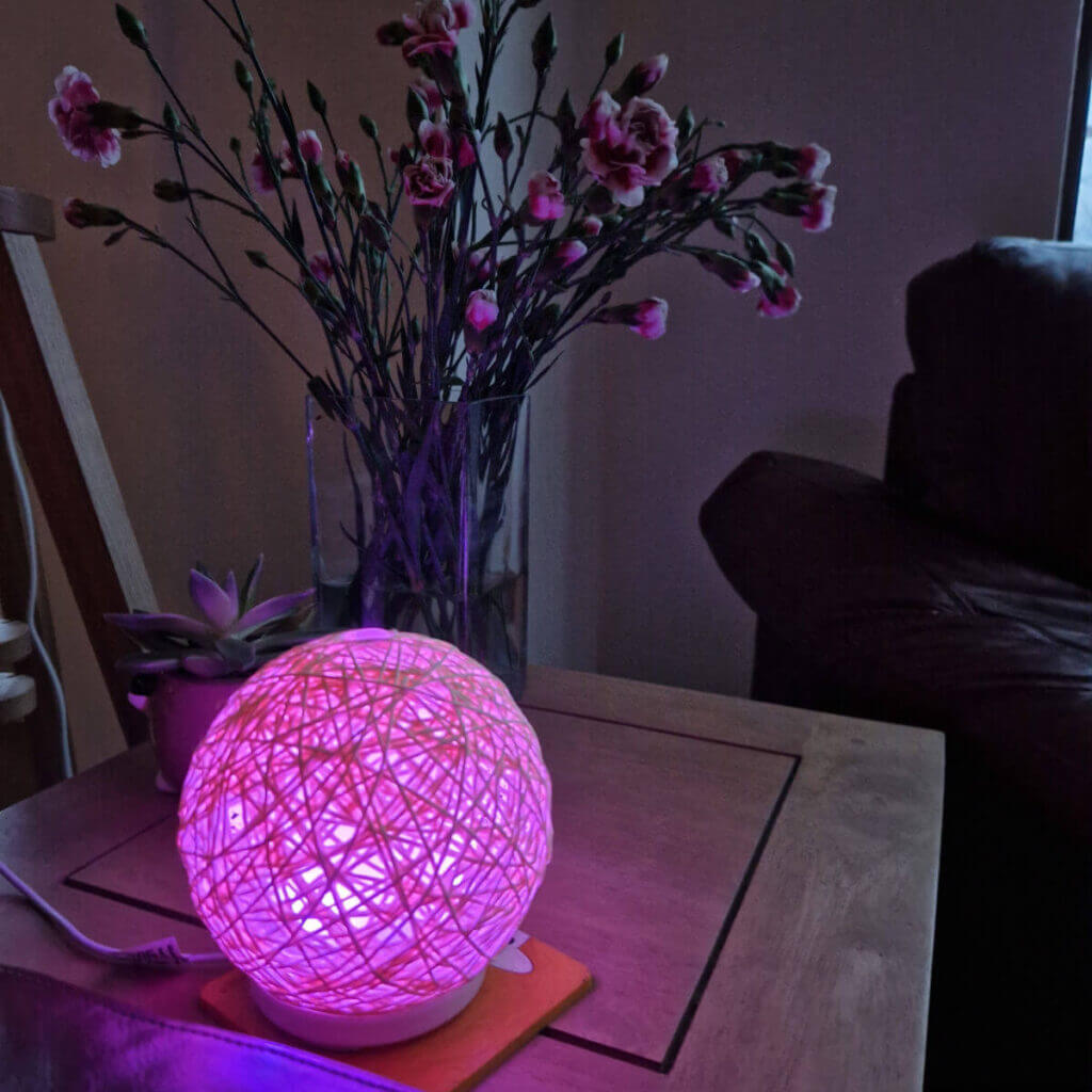 A colour-changing oil diffuser glows pink