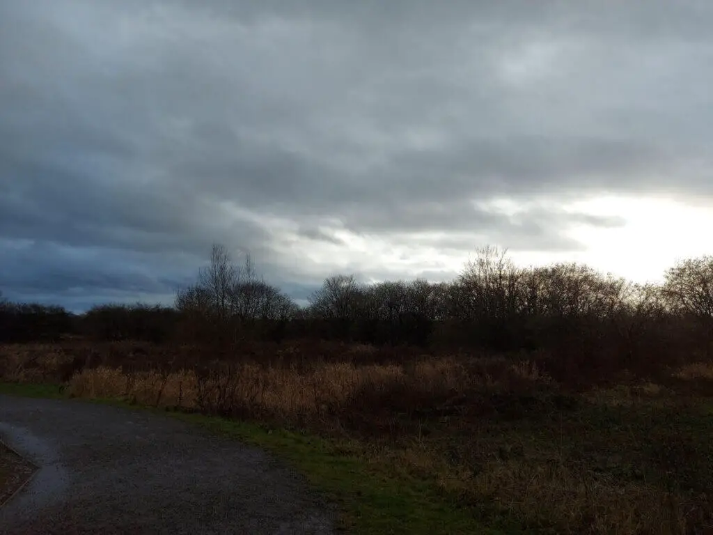 A dark sky across winter fields