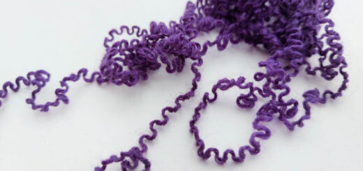 Curly purple yarn - the result of a project being unravelled