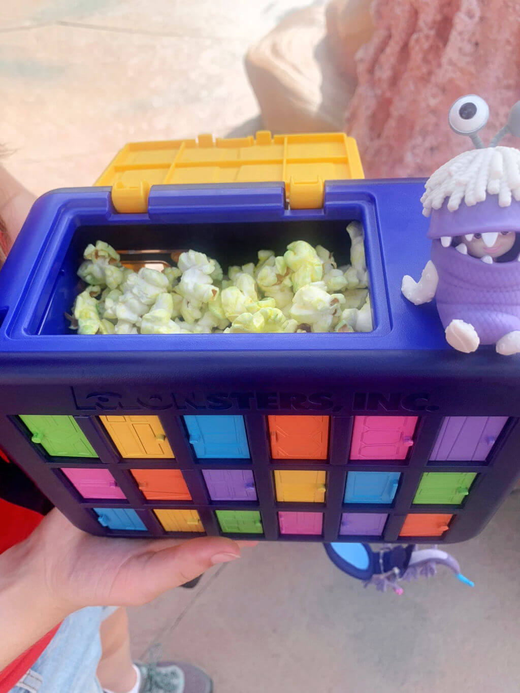 A square Monsters Inc popcorn bucket