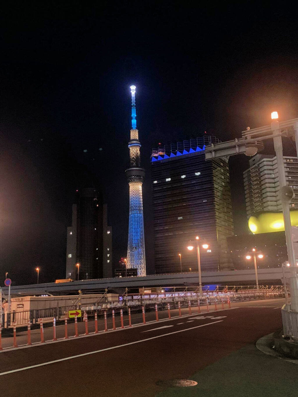 A tall building lit up against the night sky