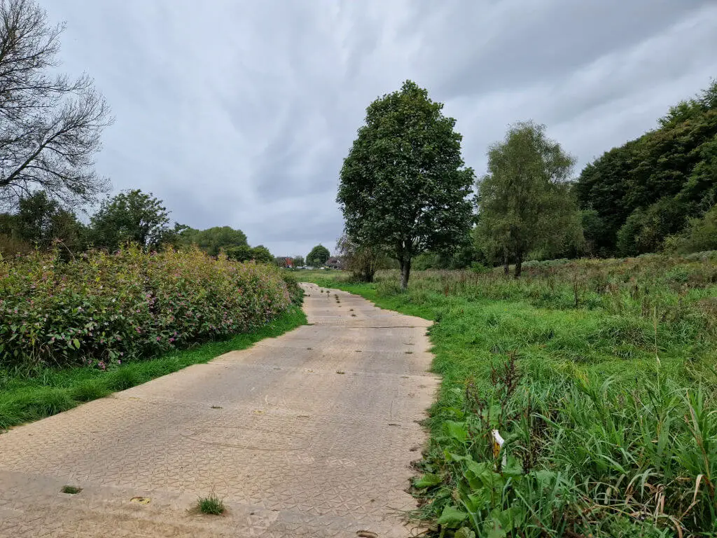 A temporary roadway laid on a grass path