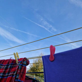 Blue sky above washing on a line