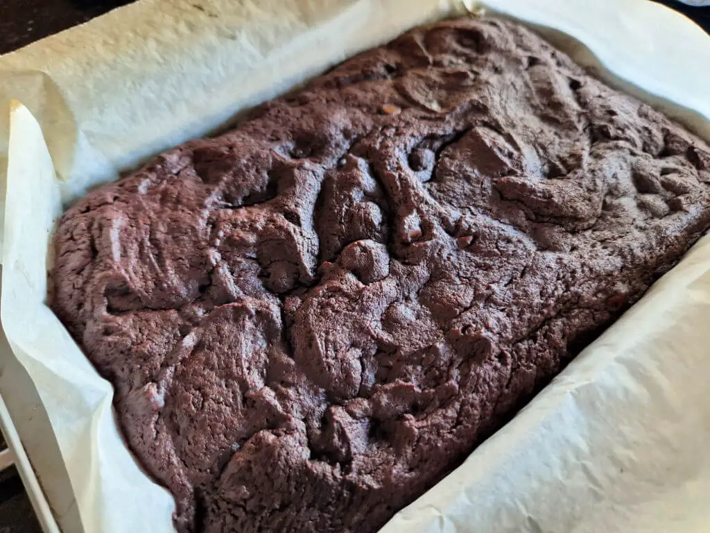 A chocolate brownie just out of the oven before cooling and slicing
