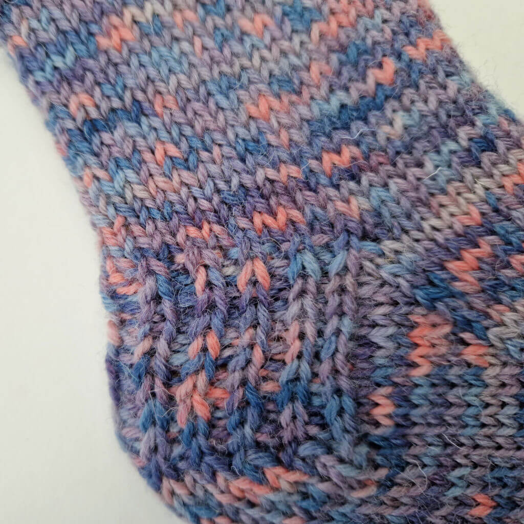 A close up photo of the heel stitch on a sock heel flap