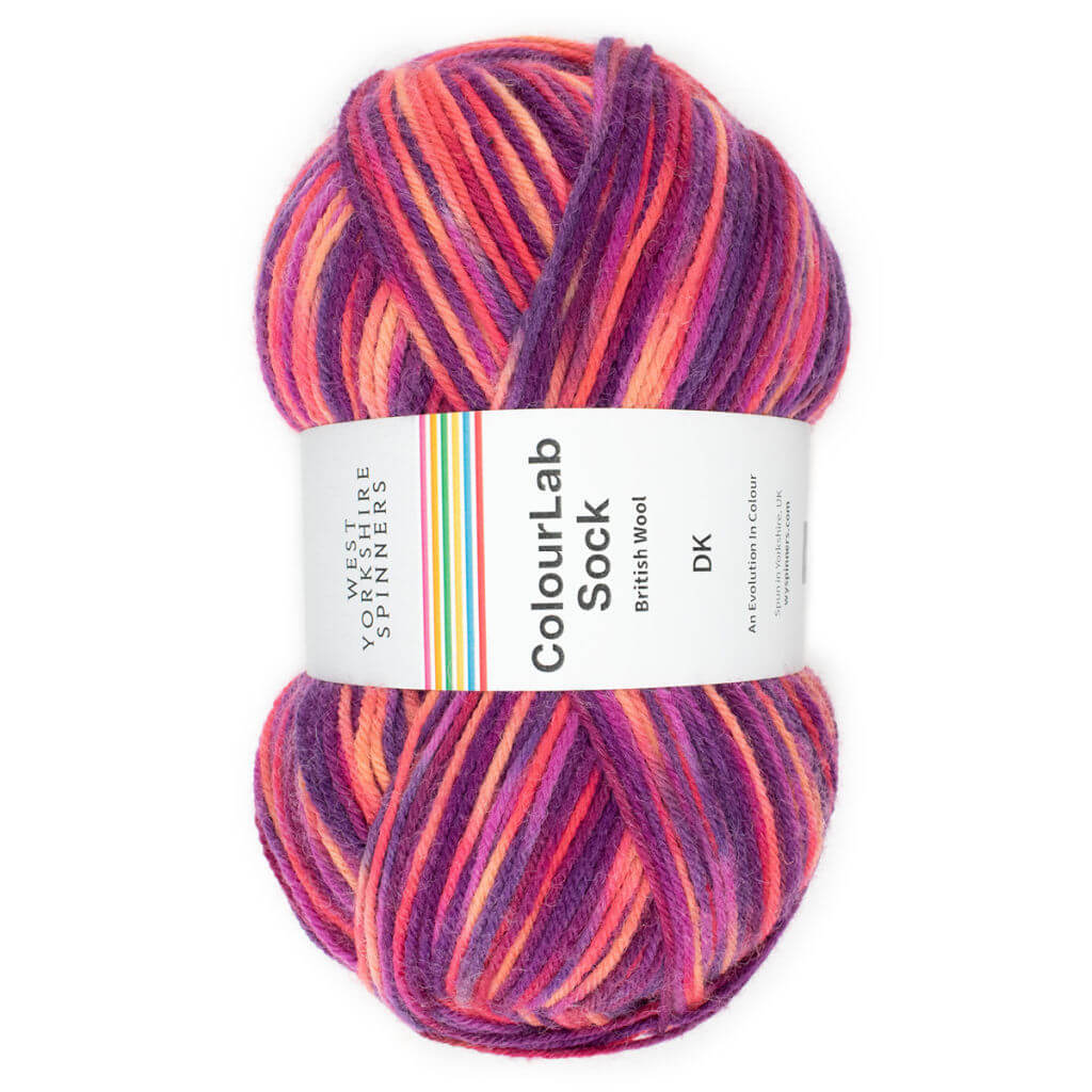 A single ball of yarn in shades of red and pink with a ball band describing it as ColourLab Sock
