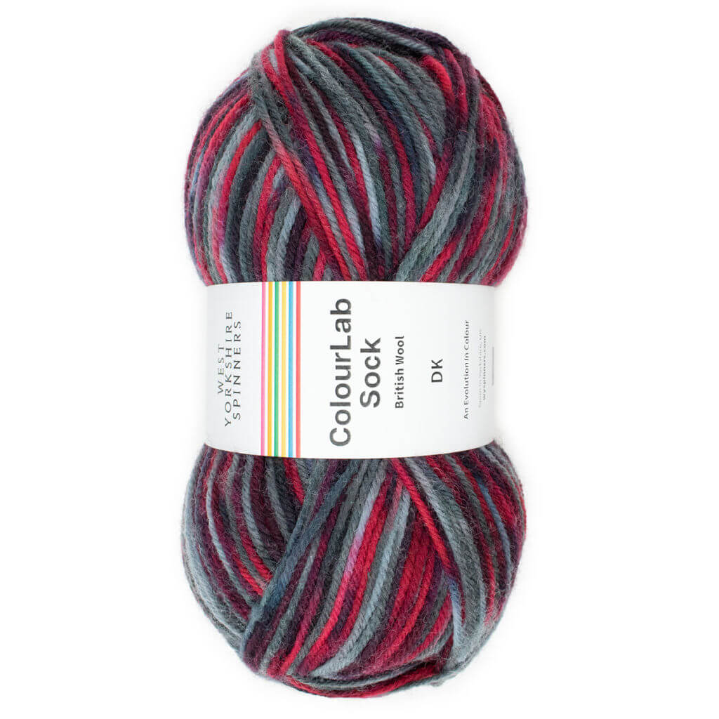 A single ball of yarn in shades of black, grey and red with a ball band describing it as ColourLab Sock
