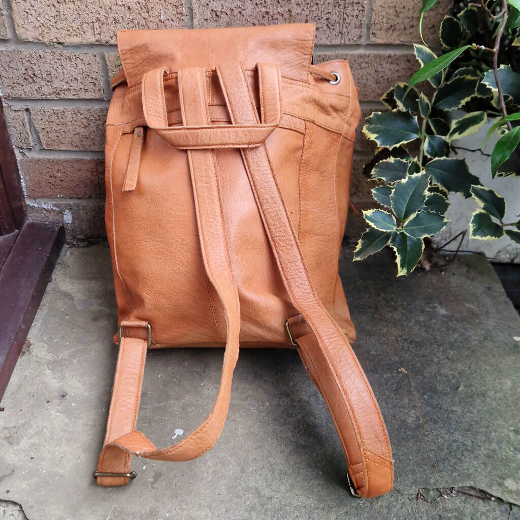 A photo of the straps attached to the back of a Muud Gimo backpack