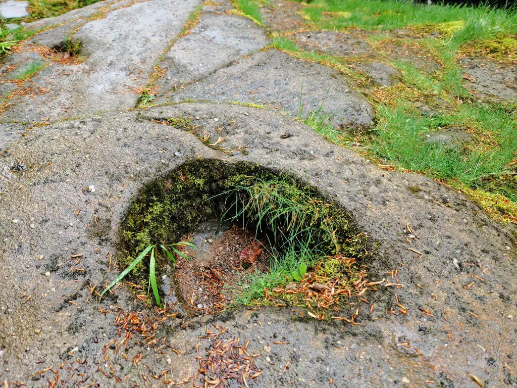 A round hole worn in the rock by water 