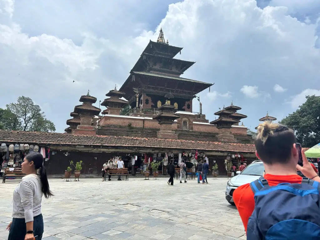 A pagoda building situated behind a large paved area