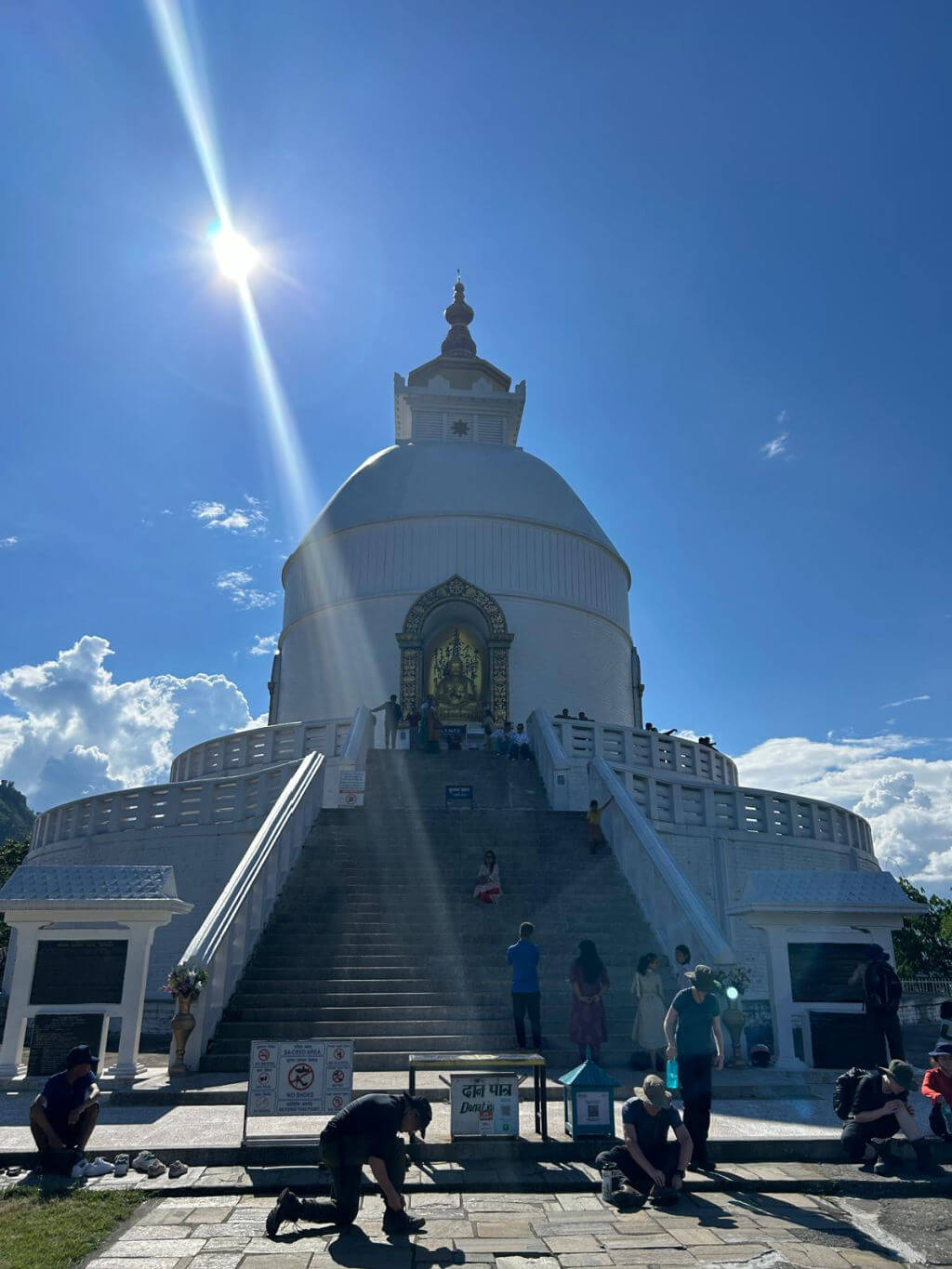 A white domed building against a bright blue sky