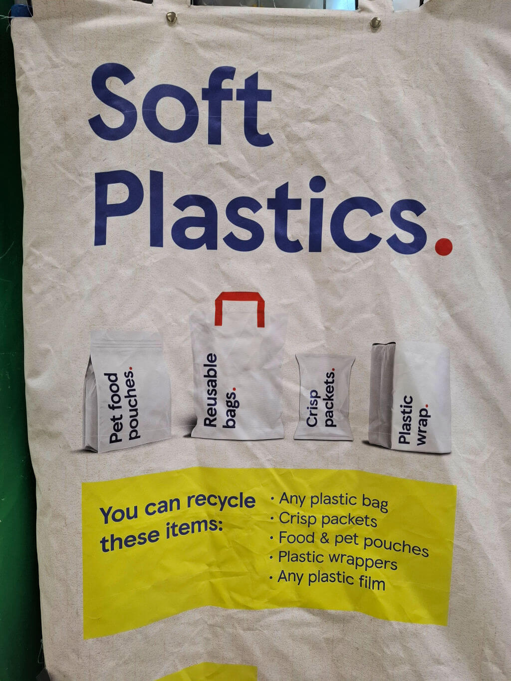 The side of a large wire container for recycling plastices