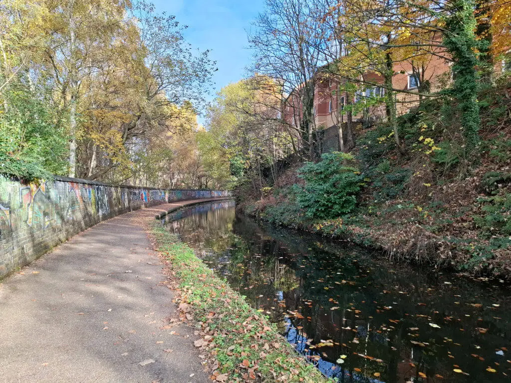 A sunny towpath next to a canal