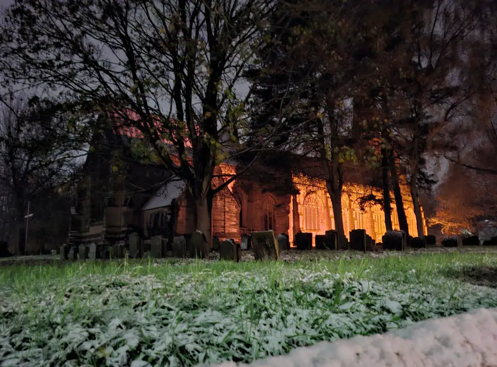 A church at night, lit by floodlights