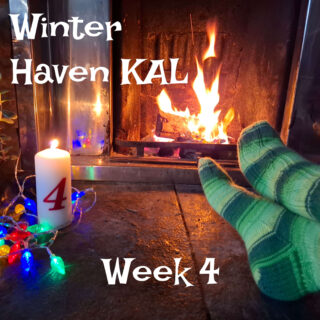 A pair of feet resting on a stone hearth modelling green striped socks, a tall candle with the number 4 on it and fairy lights. There is a fire blazing in the background.