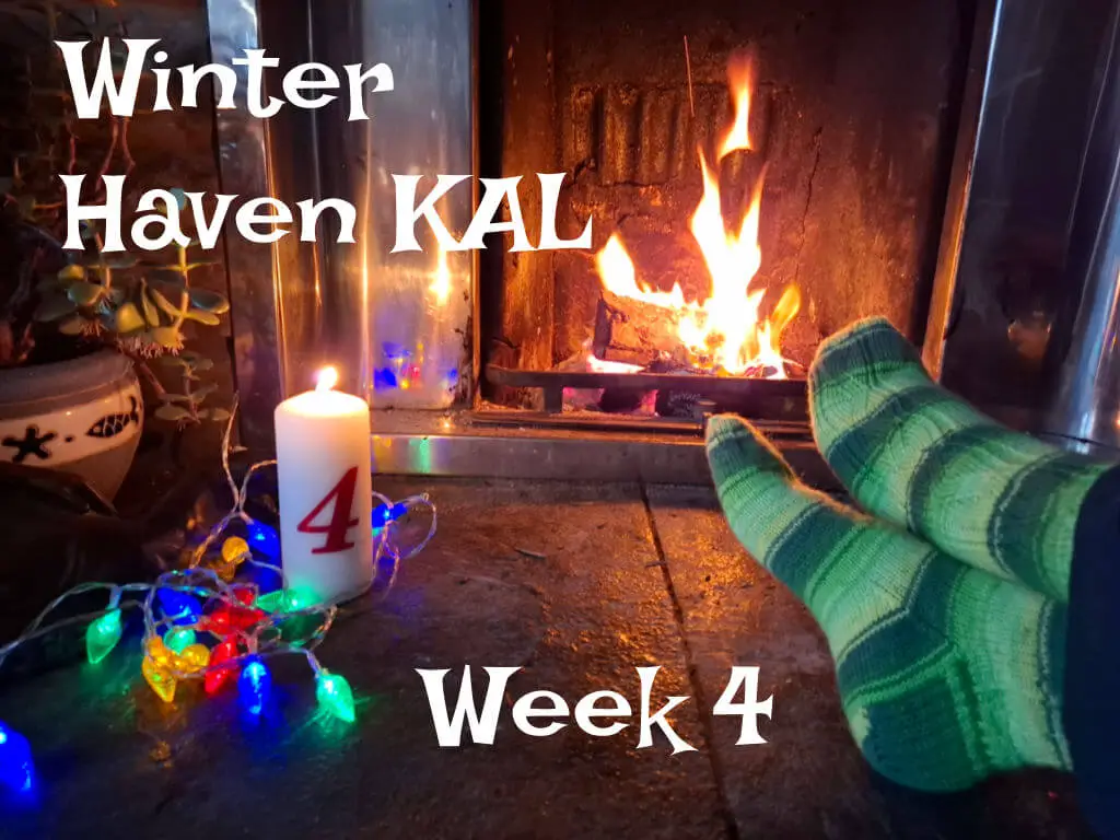 A pair of feet resting on a stone hearth modelling green striped socks, a tall candle with the number 4 on it and fairy lights. There is a fire blazing in the background.