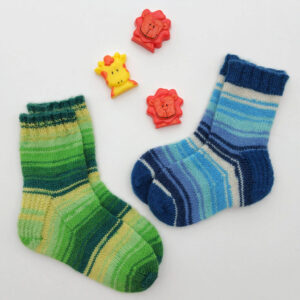 Two pairs of striped socks on a white background, one in green shades and the other in blue. Above are three colourful animal-shaped puzzle pieces. Winwick Mum | Basic 4ply Children's Socks | Beginner sock knitting | Free sock knitting patterns