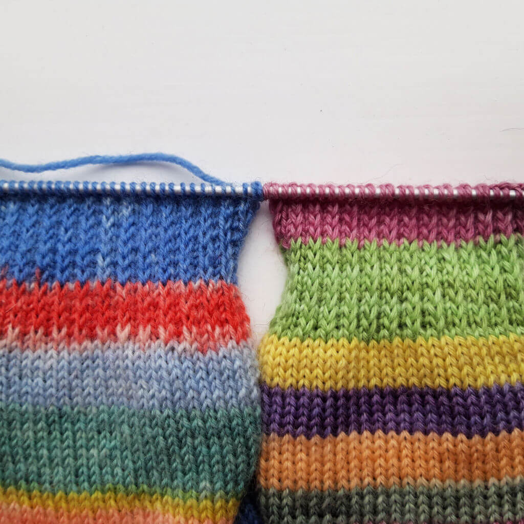 Two knitting swatches display vibrant stripes on needles. The left features blue, red, and green, while the right shows pink, green, and purple tones. Winwick Mum | beginner sock knitting | slip stitches knitwise or purlwise