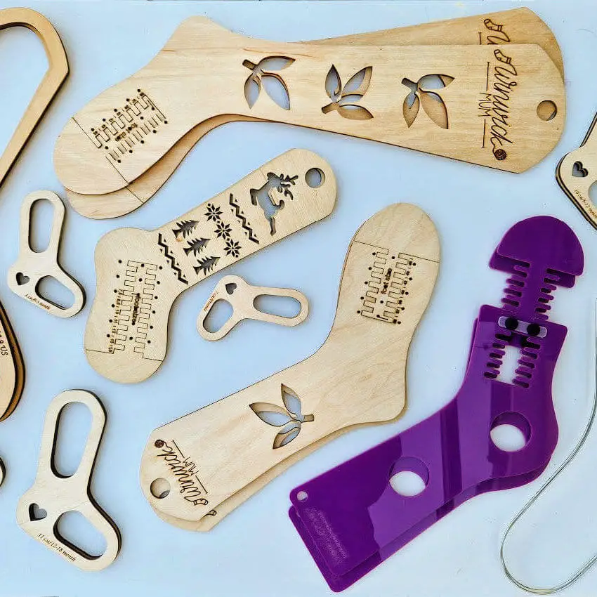 A selection of sock blockers made of wood, acrylic and wire are displayed on a white background. Winwick Mum | Blocking socks with sock blockers